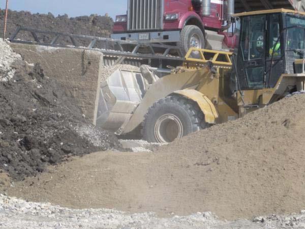 stockpiles Place a separation layer on top of soil