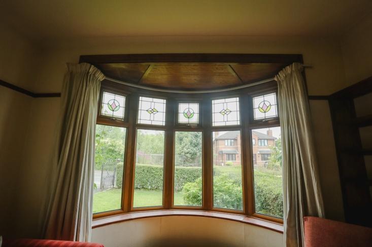 Sitting Room: 15/6 x 11/6 into circular bay window with oak grain wood effect Upvc double glazed