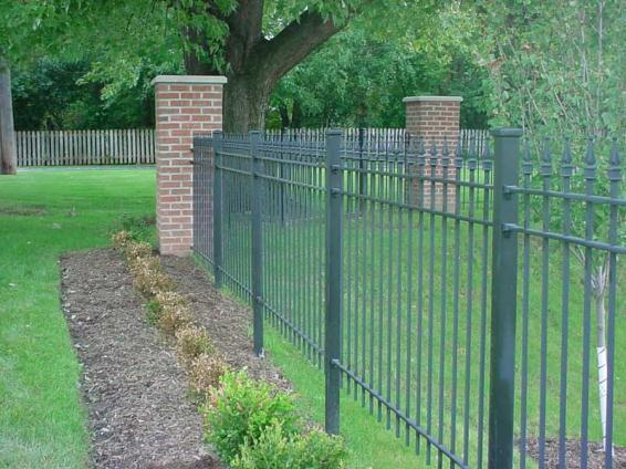 b) Fences, walls, and dense landscaping hedges are permitted within the same district as a screening device. 1) Landscape hedges shall be a minimum 6 feet tall.