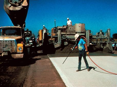 Cleaning the Surface to Prepare for Bonding Sweeping surface followed by compressed air cleaning in front of the paver.