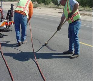 A squeegee should be used to provide a 1 to 3 overband on each side of the crack. Step 3. Application of blotter.