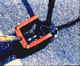 A squeegee should be used to provide a 1 to 3 overband on each side of the crack. Step 4. Application of blotter.