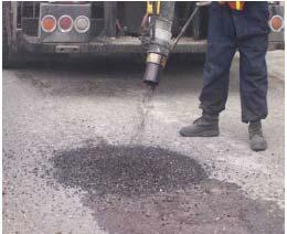 50 1-4.02(l) Spray Patching Spray patching is effective at filling potholes, wide cracks, and other localized distressed areas in an asphalt pavement.