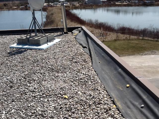 Photo 7 Perimeter flashing is wide open. Photo 8 Single Ply Tears: A typical single ply EPDM rubber roof membrane is approximately 1 millimeter thick.
