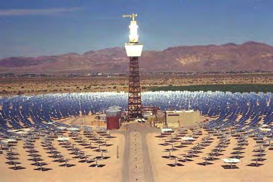 The central receiver of the Solar Two SEGS plant in Daggett, California, glows with sunlight reflected by its circular array of heliostats.