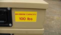 The drawer assembly data labels (1) are on the right side of each drawer. On the front of each drawer there is a 100 lb. maximum capacity label (2).