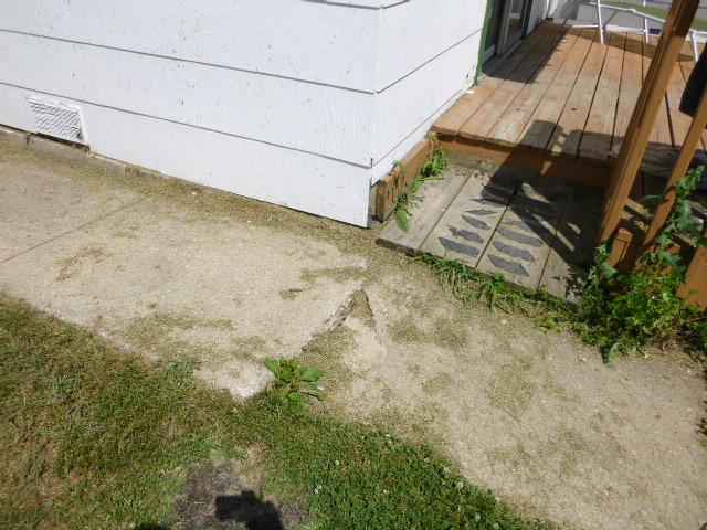 HOME INSPECTION REPORT Repair damaged driveway and walkway.
