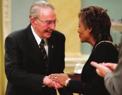 Jean-Robert Gauthier receives the Order of Canada from Governor General Michaëlle Jean in 2007. As a senator, M. Gauthier championed Francophone rights.