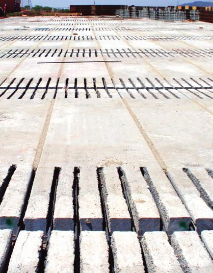 COMPOSITE CONSTRUCTION Introduction The term composite refers to structures where prestressed slabs and in-situ concrete work together to form an integral structural component.