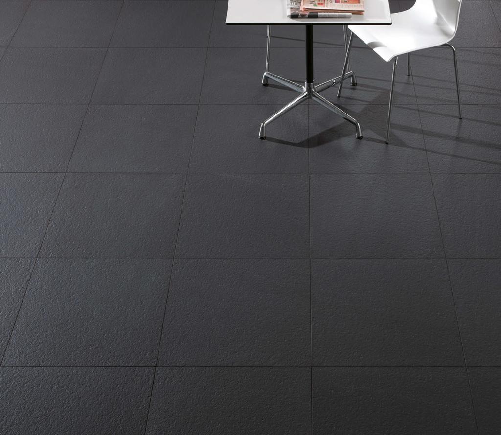 Cover photo features Artic and Light 24 x 24 Unpolished field tile in a grid pattern on the floor.. Above photo features Dark Textured in 24 x 24 grid pattern on the floor.