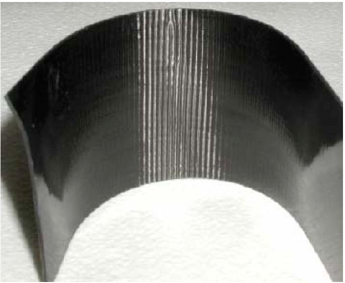 composite because the resin bonds more readily with carbon fiber than fiberglass. This may be because of the sizing treatment carbon fiber undergoes to facilitate resin bonding.