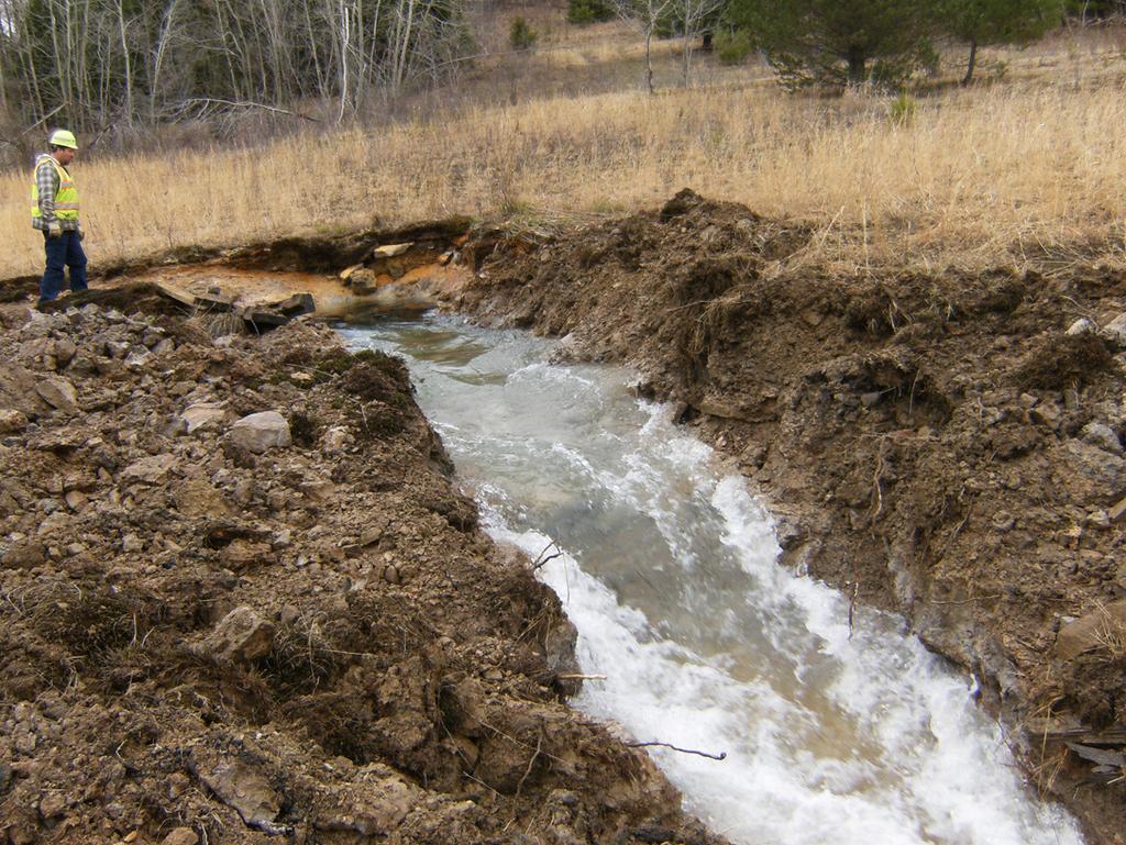 In 2011, before work began to drawdown the mine pool, pressure within the mine exploded out of the hillside above the mine seal sending millions of gallons of polluted water into the South Branch