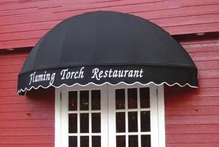 Awnings and canopies must be permanently attached to buildings. The minimum height of awnings shall be 8 feet from the lowest point to the sidewalk. Open-ended awnings are preferred.