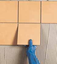 Suitable for laying tiles with highly-ribbed or deep-set backs, and for laying on uneven substrates and renders without levelling them out beforehand, up to a thickness of 15 mm.