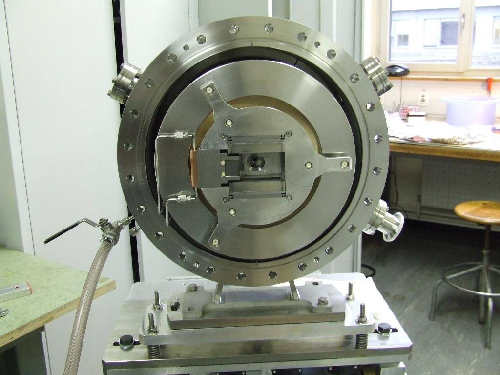 injection flanges with ignition gap, (5) ceramic isolation disks, and (6) front-end chamber Ion Source applications at the Universidad Autonoma