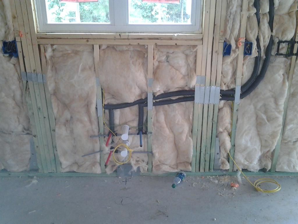 Plumbing And Wiring Insulation is placed between outside and pipes.