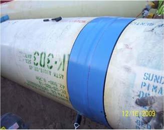 Field joint completion of cement mortar coated pipe is done by placing lean concrete into a diaper which totally encompasses the field joint.