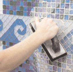 Using non-sanded grout for joints 0-1/8, or standard grade sanded grout for back beveled glass and
