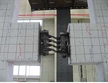 The pinching effect is also apparent in its loops. The pinching effect occurred after the concrete cracks, and the stiffness increases when the cracks close due to compression of concrete.