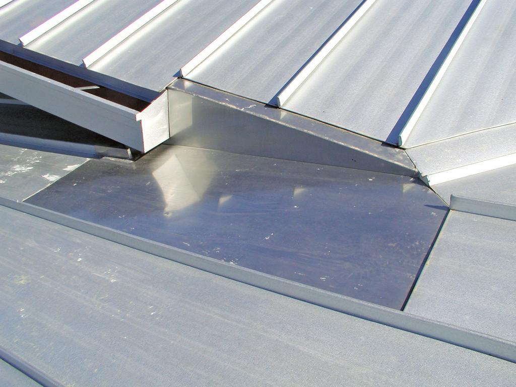 5- to 2-inch height of the valley diverter is sufficient, but certain designs may require a higher diverter when a large roof area drains onto a lower dormer valley.