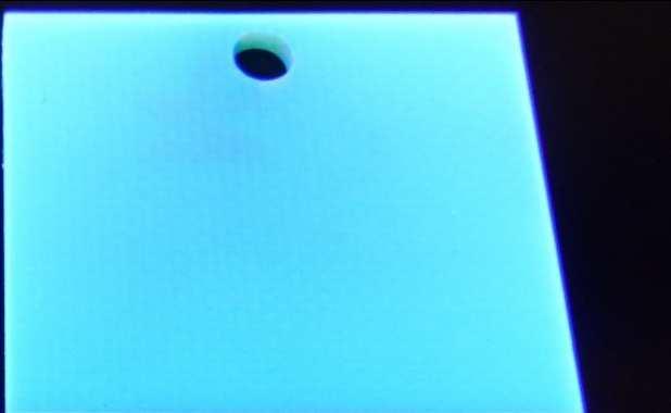 displays the Parylenecoating under an UV lamp