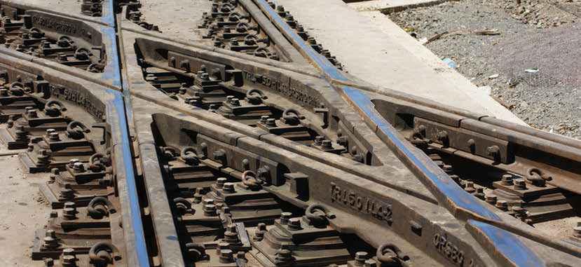 A rail fastening system for special track work on nonballasted track forms, including turnouts, diamond crossings and expansion switches.