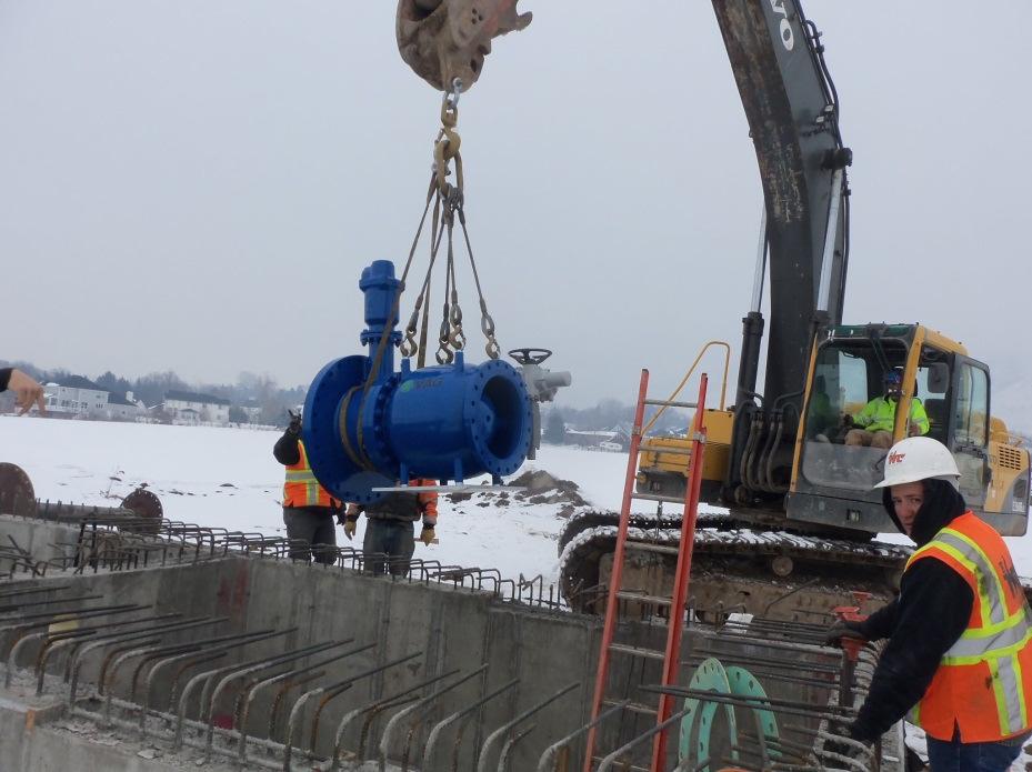 LAUB SEGMENT Whitaker Construction Lowering the plunger valve into position placed approximately 860 feet of 18 inch HDPE pipe this week.