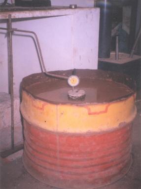 The loading was done through a circular metal plate of 10 cm diameter placed at the centre of the model flexible pavement system. Dial gauges having least count 0.