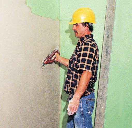 After a drying time of between one to three days, the cement or lime plaster is applied (Fig. 32). It should be approx.