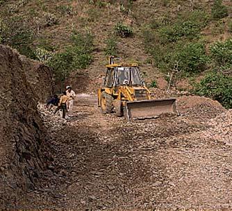 While creating an embankment, in addition to the road width, shoulders are also provided and compacted to protect the road and provide additional width to allow vehicles to