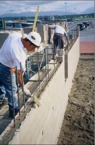 Single wythe concrete block walls, reinforced for seismic and wind loads, are contemporary examples of structural walls. What is a loadbearing wall? - These walls resist dead and live vertical loads.