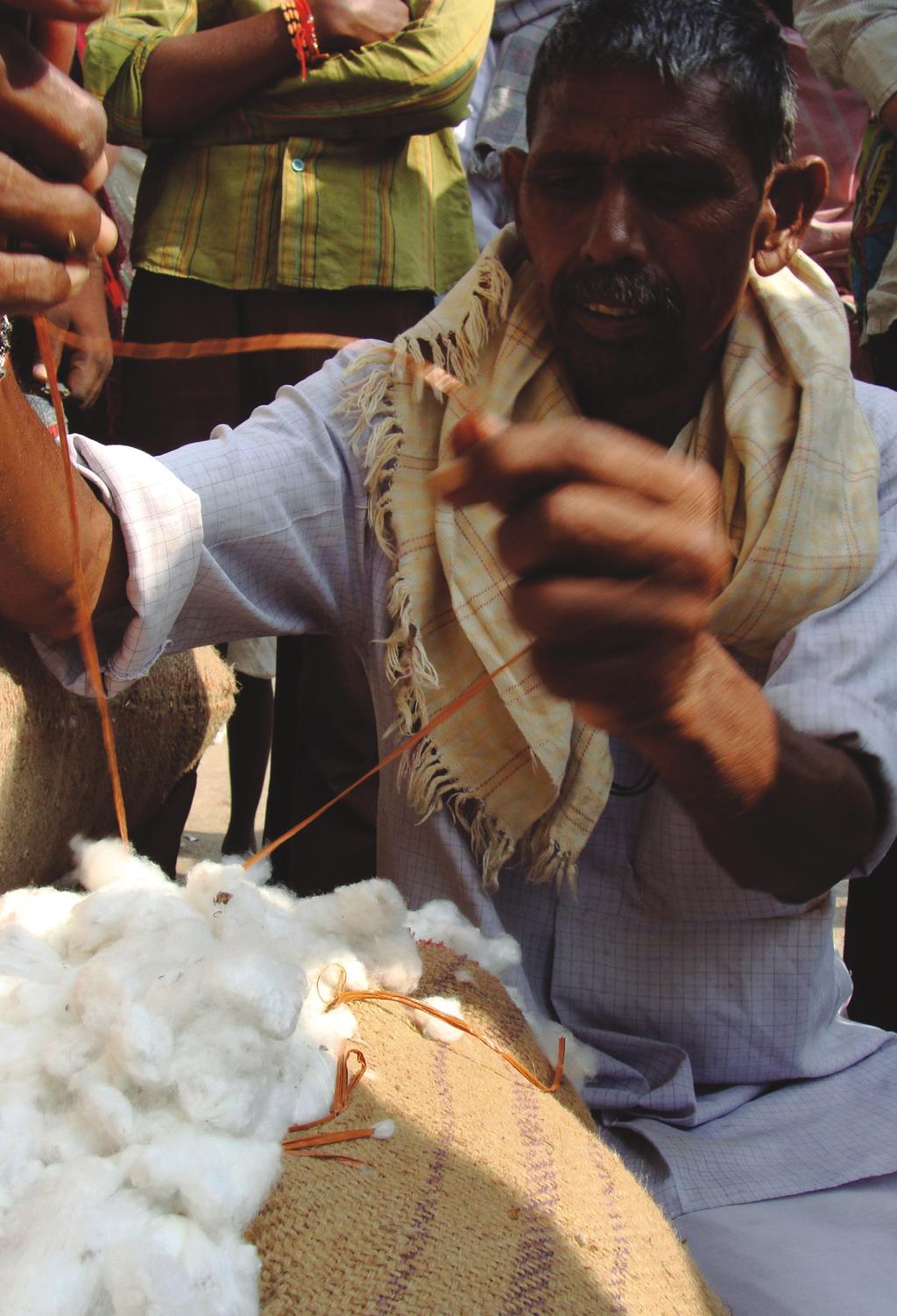 A farmer with BMP cotton at the