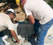 Grout must fill the keyway. For bridge foundation keyway, inspect the inside of the leg to ensure it is filled. Fill grout underneath wingwall and between the wall anchor and footing.