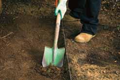 Shovel and compact your backfill (existing site soil) behind the drainage material. (Backfill consisting of heavy clays or organic soils is not recommended due to water holding properties).