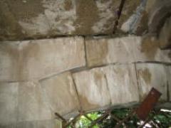 The actual stairs consist of what seems to be concrete which spans between the brick walls with significantly deteriorated mortar between the