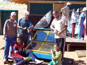 Here are a group of kids from a peace corps run environmental group who have built a solar oven helping to educate