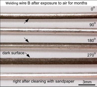 2 Mm In Diameter) After Being Exposed To Air For Months, Shown At Different Angles To Reveal Dark Areas (Arrows) On The Surface And Right After Cleaning With Sandpaper (Bottom) VIII.