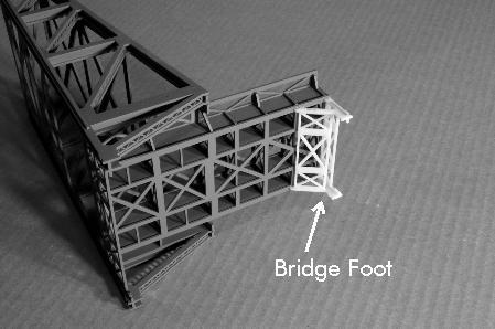 (49). See Figure 13. Glue the bridge foot to the end of the bridge tower base.