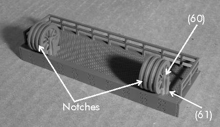 Install the railing (56) and (57) x 2 into the holes in the platform base. See figure 16. Figure 16 Assemble the hoist wheels using four parts (58) and three parts (59).