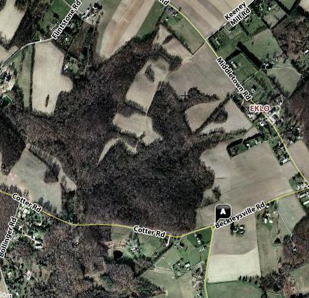 This satellite view shows that more than half of the site is covered with forest.