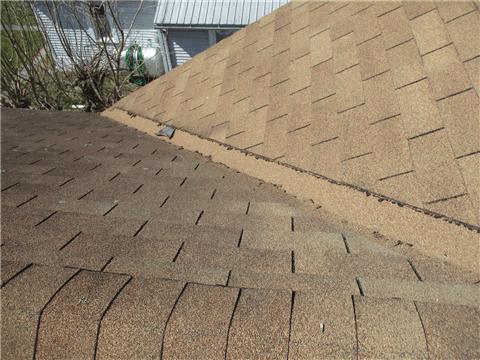 One 13) Roof Covering Condition R The roof covering shows normal wear for its age and