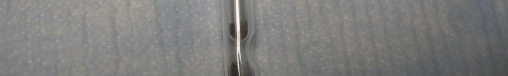 A small 6mm tube will rest on the dimple as shown in Figure 6. The 9mm Pyrex tubing and 6mm insets are in room 2222, Croul Hall.