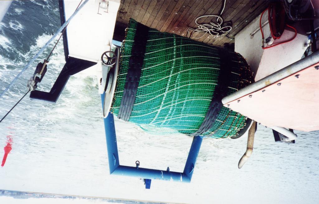Conventional seagoing vessels fitted for lowering and pulling the special net can be used (Fig. 4). Fig. 3: Field investigations with a prototype of a surface controlled net Fig.