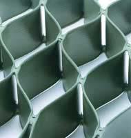 Plastic Grid Systems: These systems are often referred to as geocells and are defined by manufactured plastic lattices or mattresses that form networks of box-like cells that are filled with earth