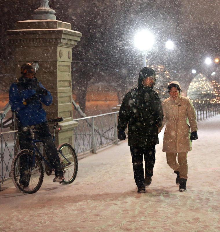 Figure 4-10: Pedestrians and bicyclist in the snow (photo courtesy of the MBTA) The GreenDOT Implementation Plan targets a reduction in the impact of our snow and ice activities through the use of