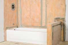 Note: When the solid backing is installed above the tub flange, apply KERDI-FIX to the tub flange and spread using a small