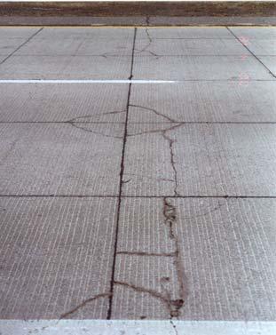 The crack in the asphalt shoulder in FIGURE marks the location of a temperature crack that extended across both lanes in the existing asphalt pavement prior to the construction of the inlay.