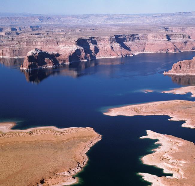 A Lake in the Desert Much of the land of Utah and Arizona is dry and rocky. This lake is an exception. Lake Powell was created when the Glen Canyon Dam was built on the Colorado River.