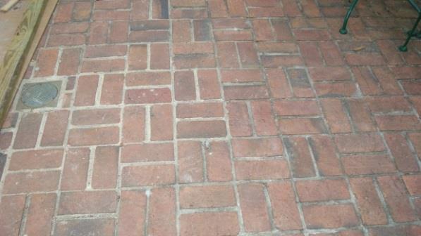 After removal of existing brick surface, remove abandoned fuel oil tank presently under the brick pavers in accordance with