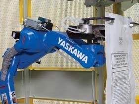 An integrated robotic arm captures the bag top and transfers it into the bag top sealer, eliminating the need for